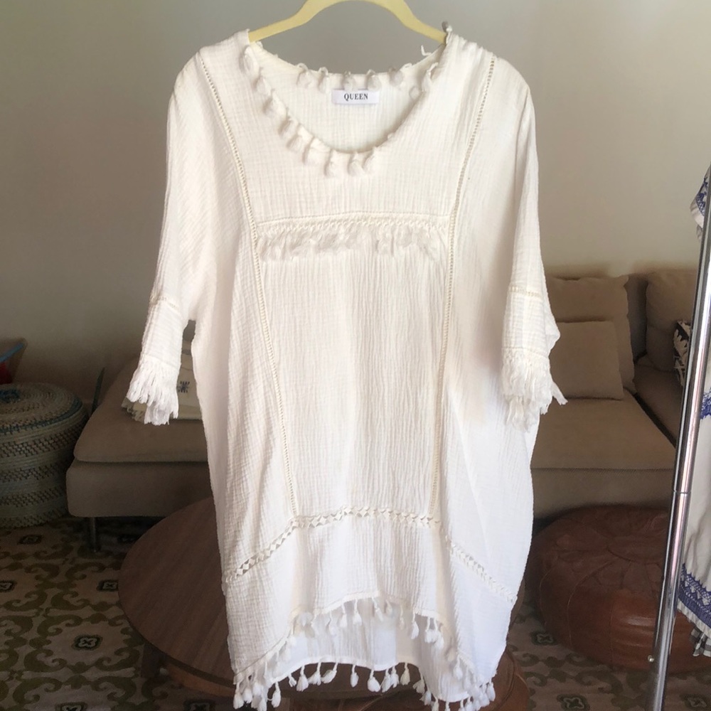 Summer dress with pretty tassel details.